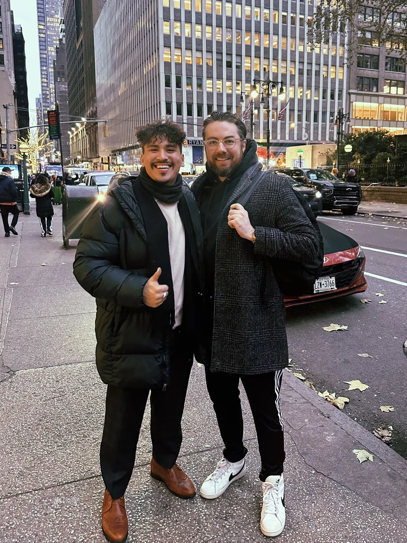 Robby with a companion on a city street.